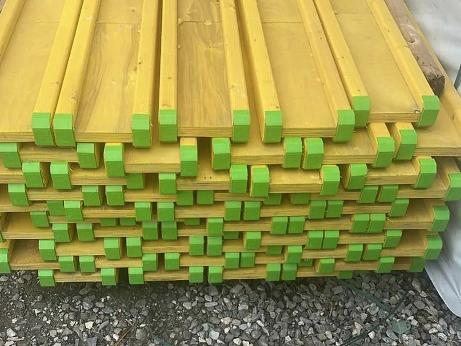 Banded packs of girders stacked in a yard